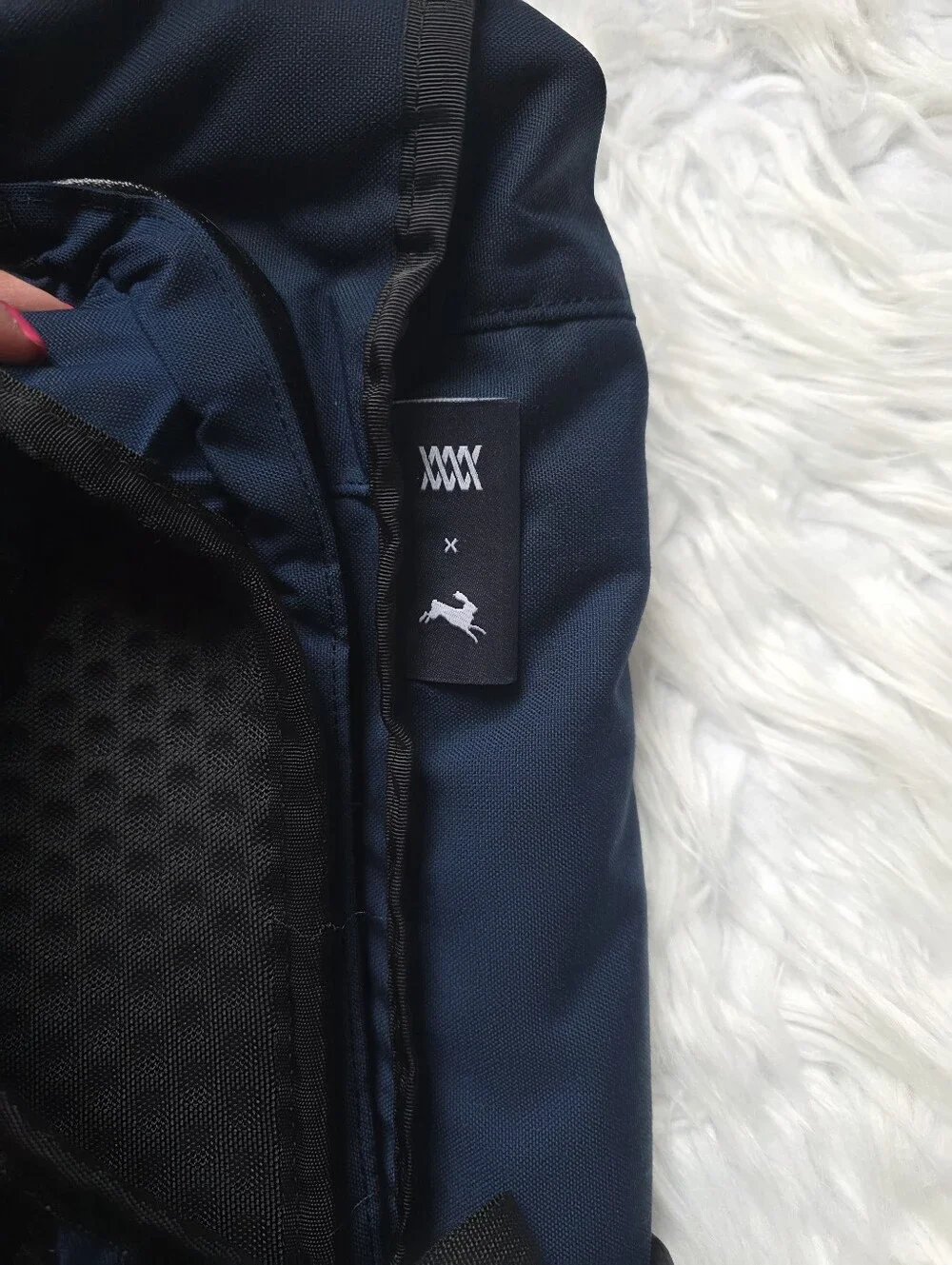 Navy Blue Roll-Top Sling Backpack with Reflective Diagonal Stripe
